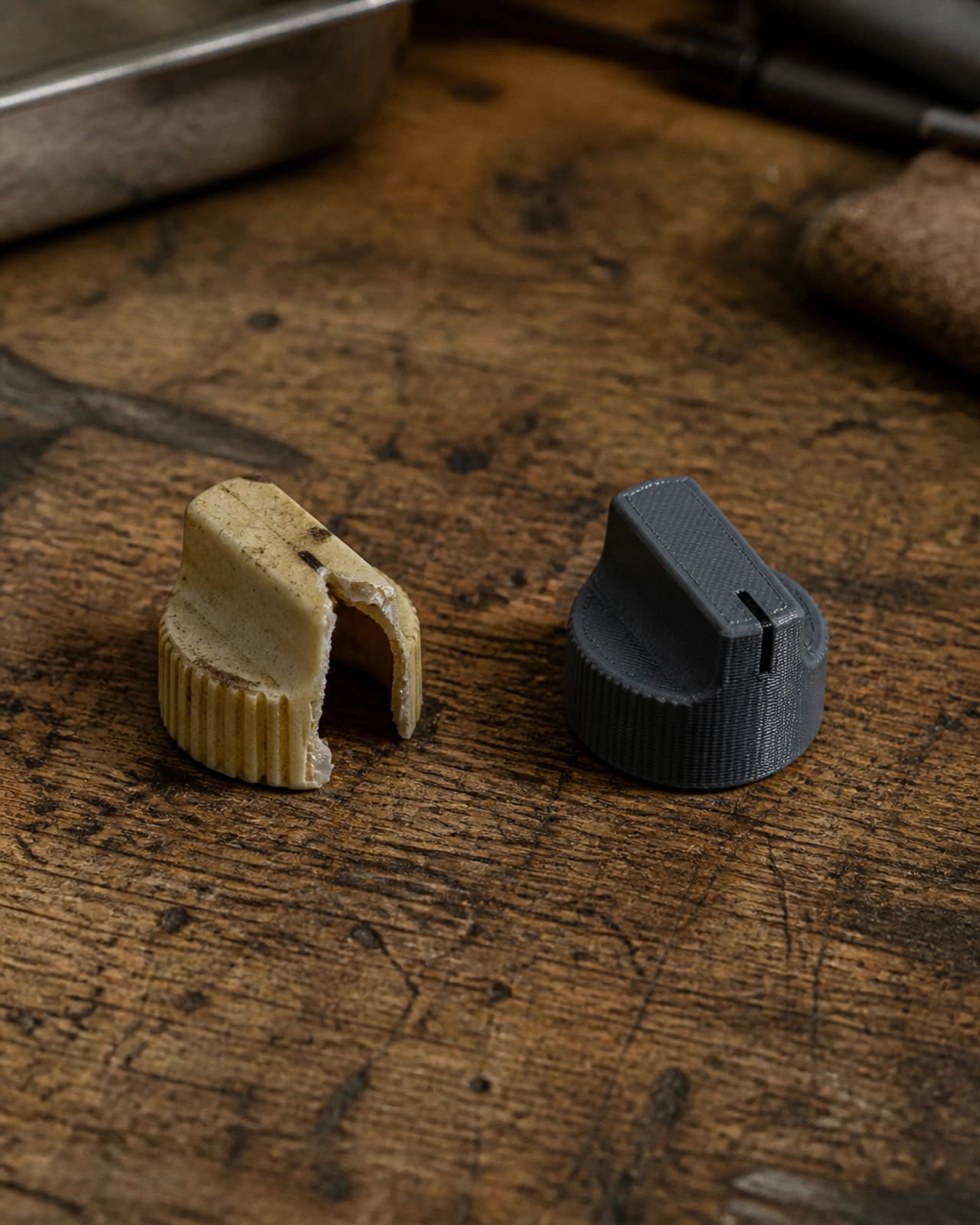 A broken vintage knob next to a fresh 3D printed replacement